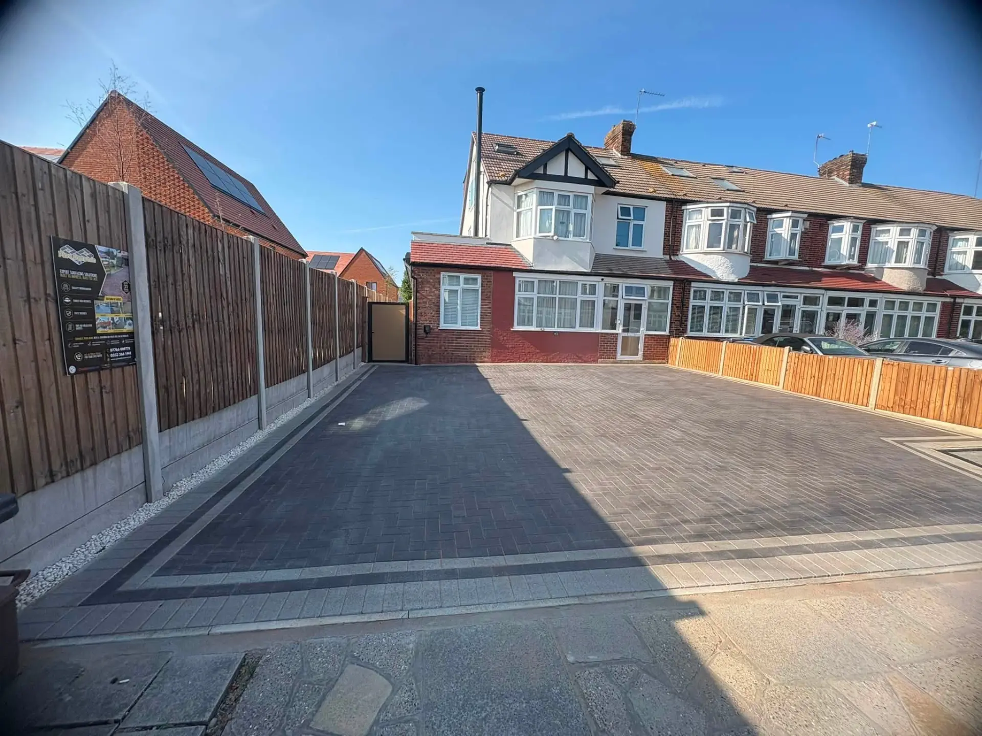 Completed block paved driveway with contrasting border and dropped kerb